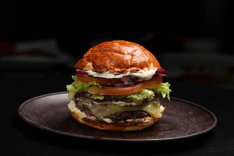 Chuys signature hand-crafted burger with fresh toppings