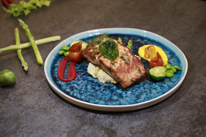 Chuys premium grilled salmon with seasonal garnish